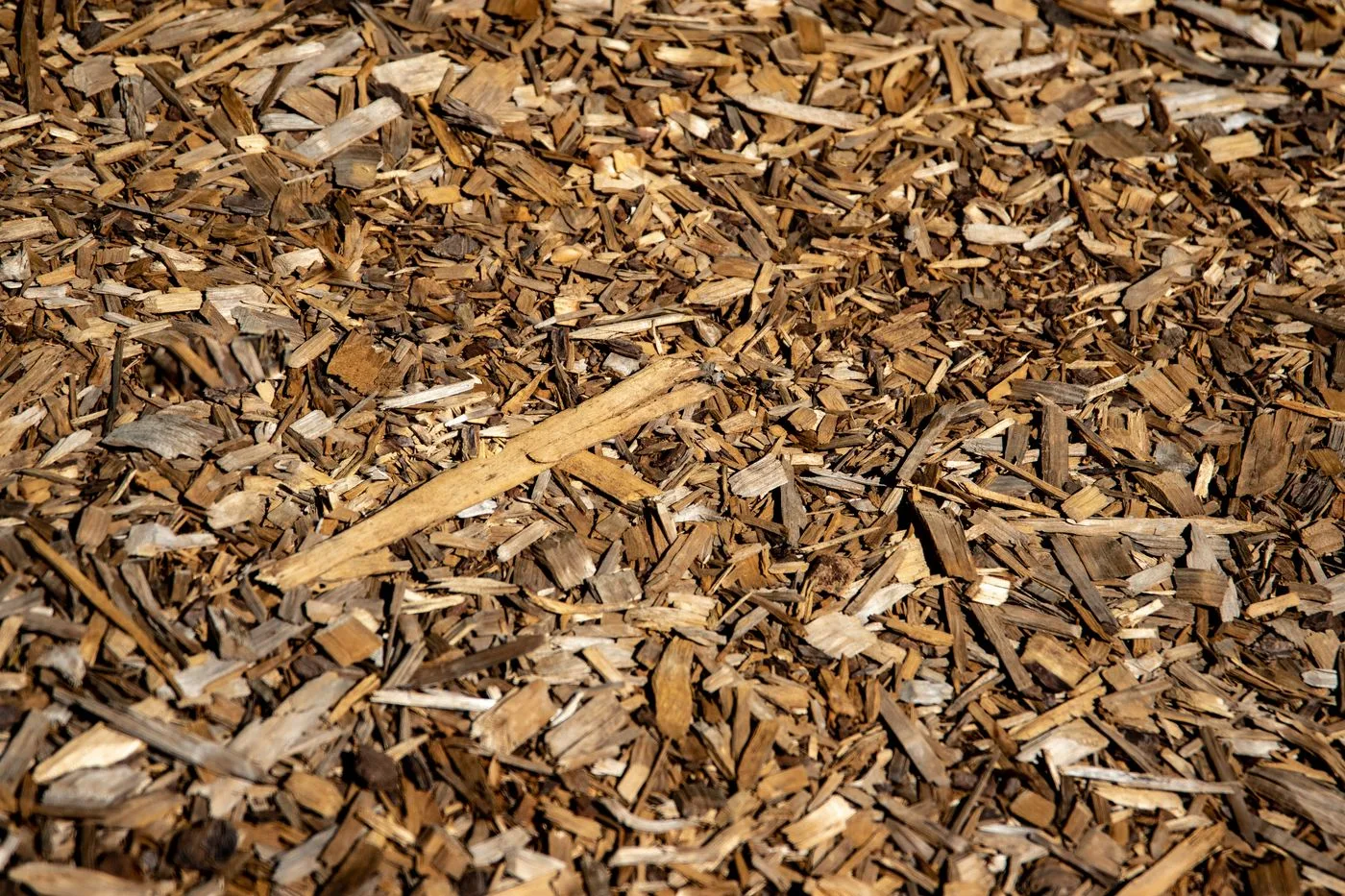 Fresh dark mulch ready for delivery and spreading in landscaped beds
